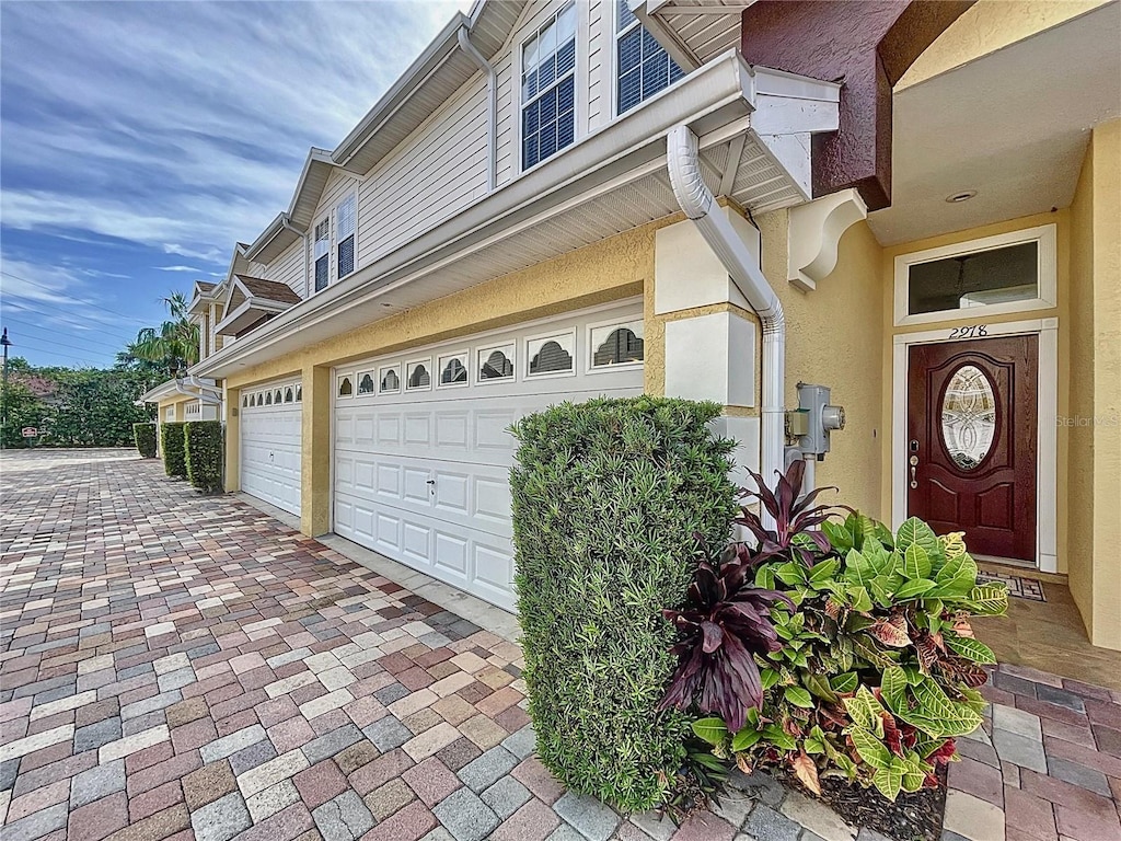 view of side of home featuring a garage