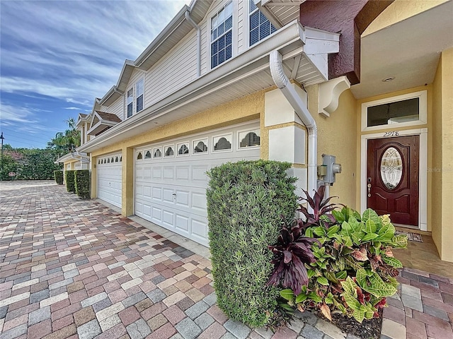 view of side of home featuring a garage