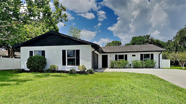 ranch-style house with a front yard