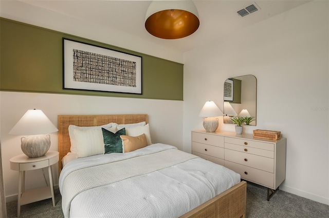 bedroom with dark colored carpet