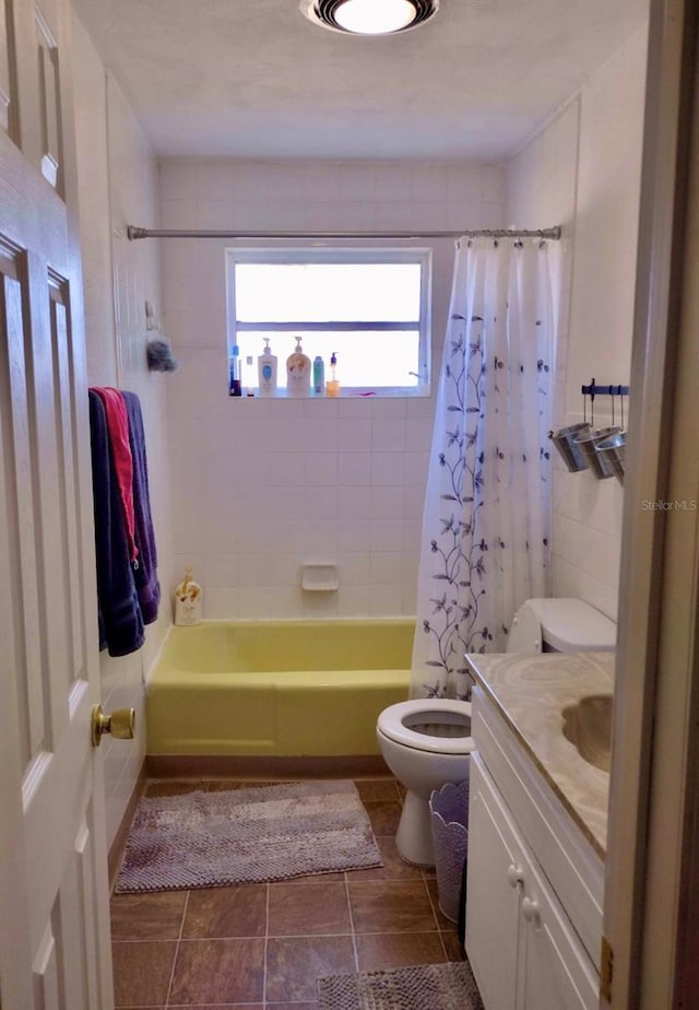 full bathroom featuring vanity, toilet, and shower / bath combo with shower curtain