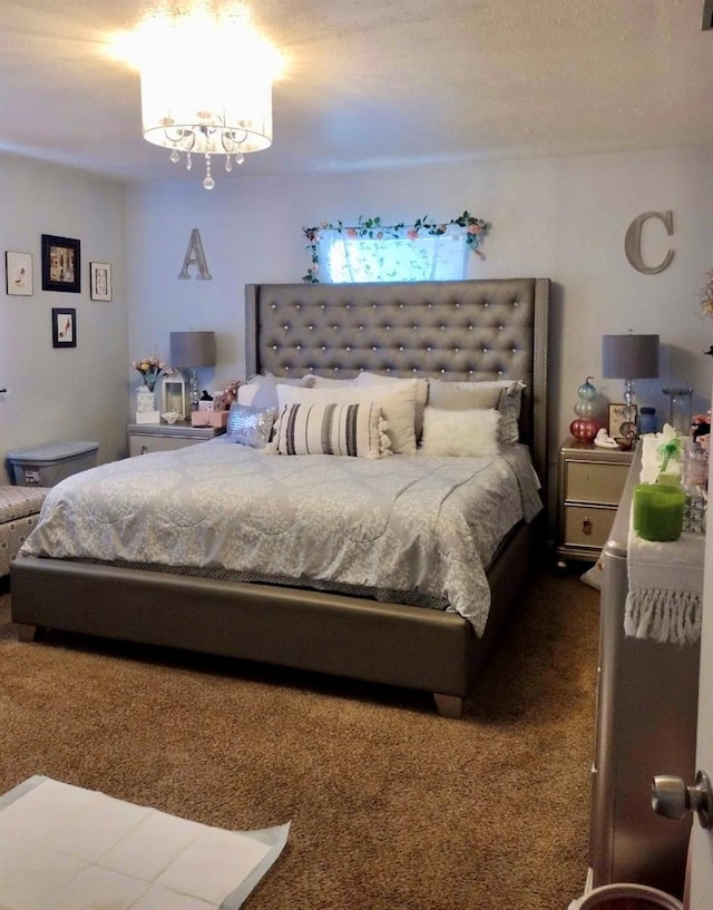 carpeted bedroom featuring a notable chandelier