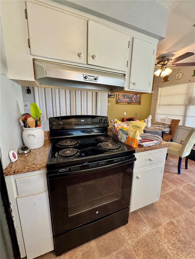 kitchen with white cabinets, black range with electric cooktop, and ceiling fan