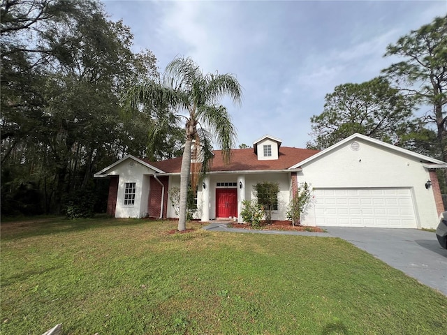 view of front of property with a front yard and a garage