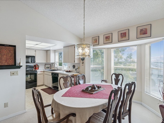 dining room featuring light carpet, a textured ceiling, vaulted ceiling, sink, and an inviting chandelier