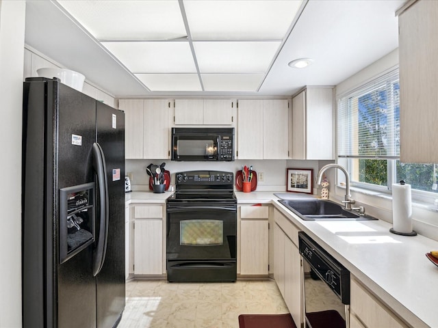 kitchen featuring sink and black appliances