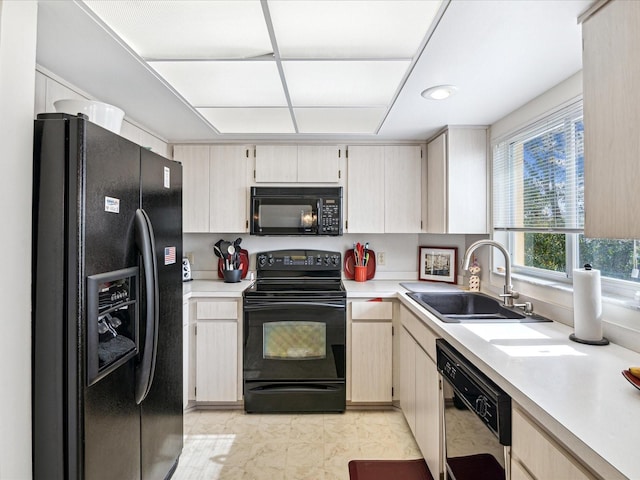 2231 Utopian Dr E Unit 321, Clearwater, FL 33763 - kitchen featuring black appliances, a sink, light countertops, and recessed lighting