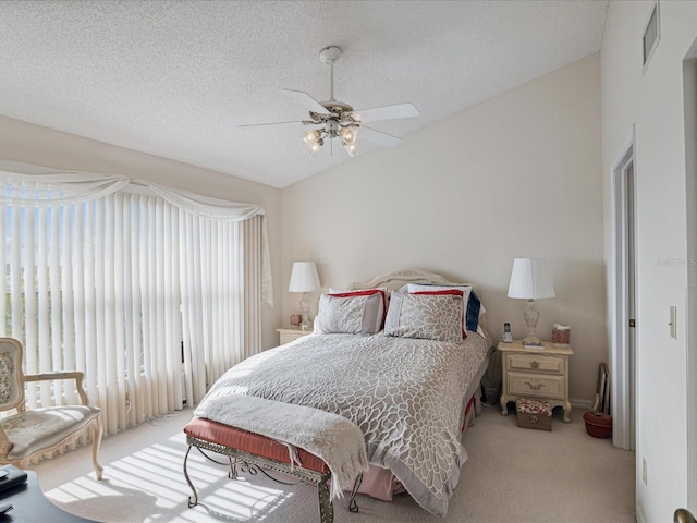 2231 Utopian Dr E Unit 321, Clearwater, FL 33763 - carpeted bedroom with lofted ceiling, a textured ceiling, and a ceiling fan