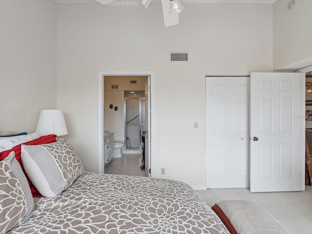 2231 Utopian Dr E Unit 321, Clearwater, FL 33763 - bedroom featuring a high ceiling, carpet floors, a closet, ensuite bathroom, and a ceiling fan