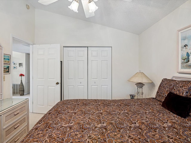 carpeted bedroom featuring a textured ceiling, a closet, high vaulted ceiling, and ceiling fan