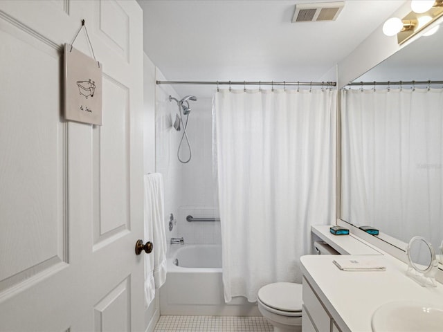 full bathroom with toilet, vanity, tile patterned floors, and shower / tub combo with curtain