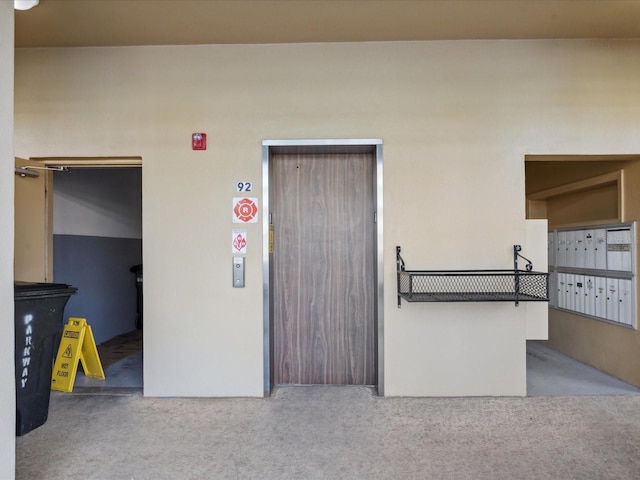 2231 Utopian Dr E Unit 321, Clearwater, FL 33763 - entrance to property with elevator and stucco siding