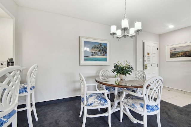 carpeted dining room featuring an inviting chandelier