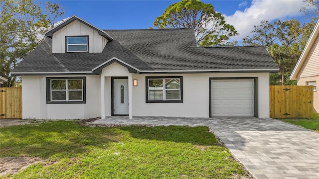 view of front facade with a garage and a front yard