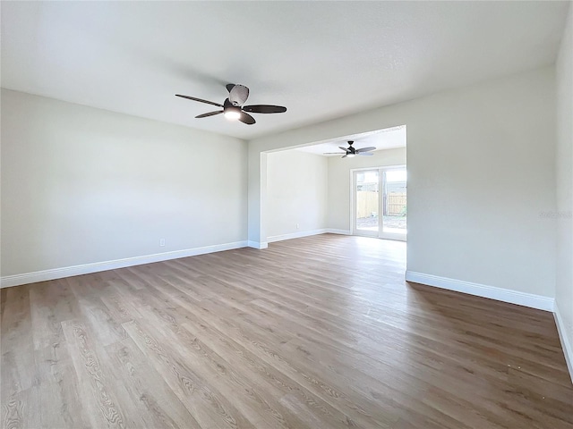 spare room featuring ceiling fan and light hardwood / wood-style floors