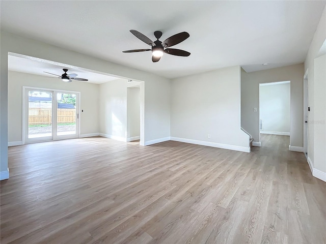 unfurnished room with ceiling fan and light wood-type flooring