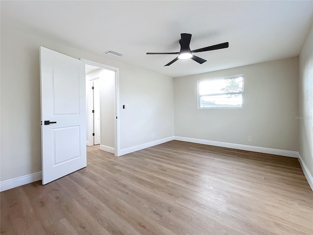 unfurnished room featuring ceiling fan and light wood-type flooring