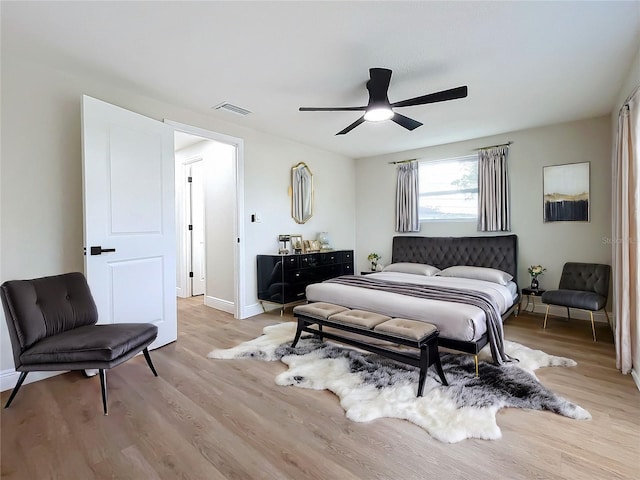 bedroom with ceiling fan and light wood-type flooring