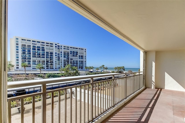 balcony featuring a water view