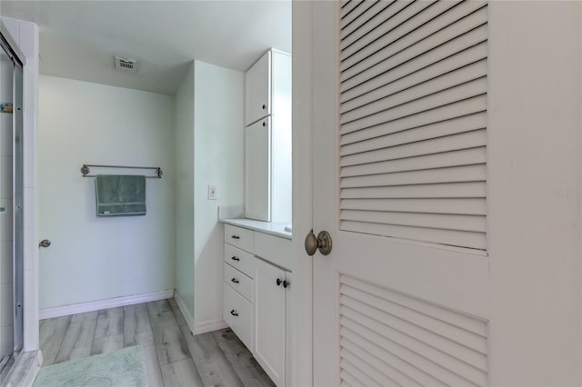 bathroom featuring vanity and wood-type flooring