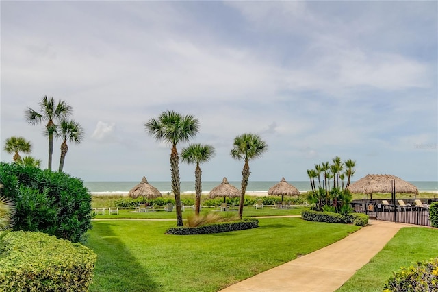 view of community featuring a yard and a water view