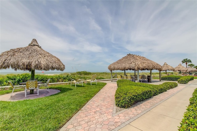 surrounding community with a yard, a patio, and a gazebo