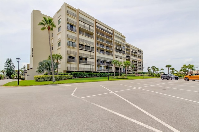 1430 Gulf Blvd Unit 204, Clearwater Beach, FL 33767 - view of apartment building / complex featuring uncovered parking