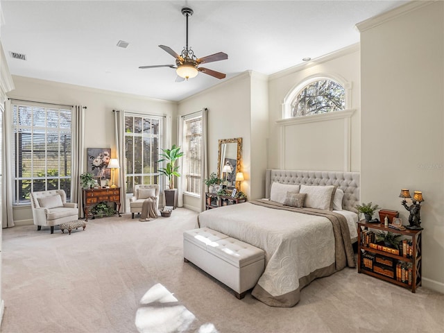 bedroom with ceiling fan, light colored carpet, and ornamental molding