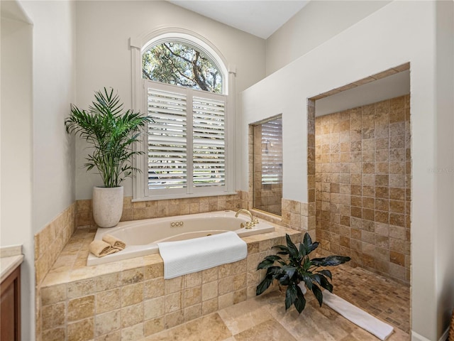 bathroom with tiled tub