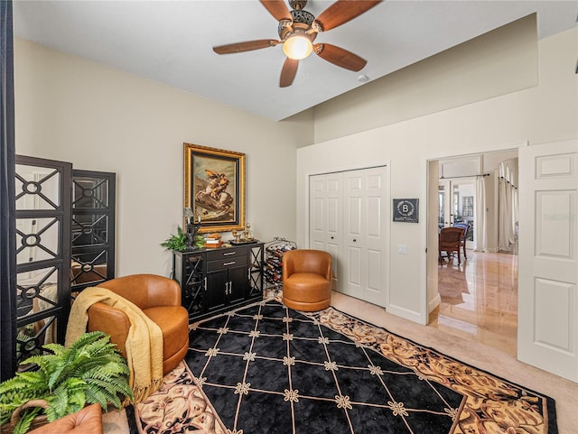 living area featuring ceiling fan