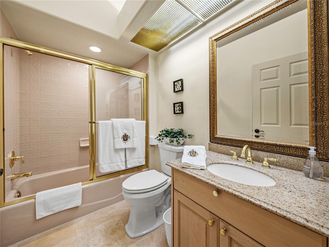 full bathroom with tile patterned flooring, toilet, vanity, and combined bath / shower with glass door