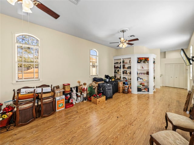 interior space featuring light hardwood / wood-style flooring and ceiling fan