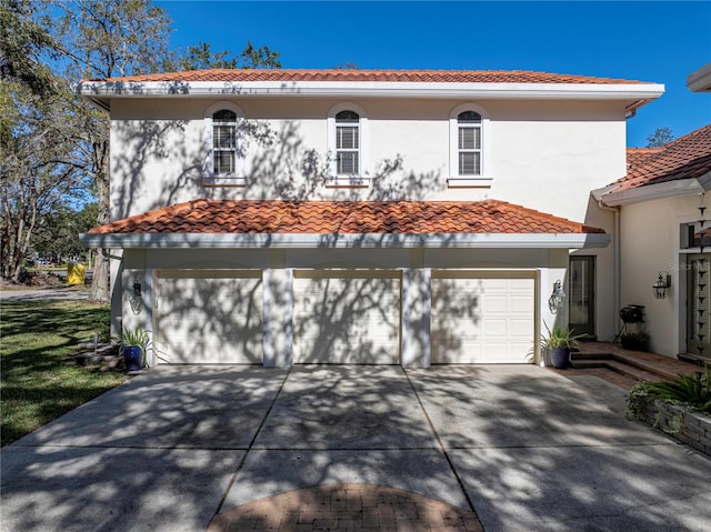 mediterranean / spanish-style home featuring a garage