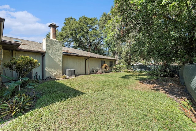 view of yard featuring central AC