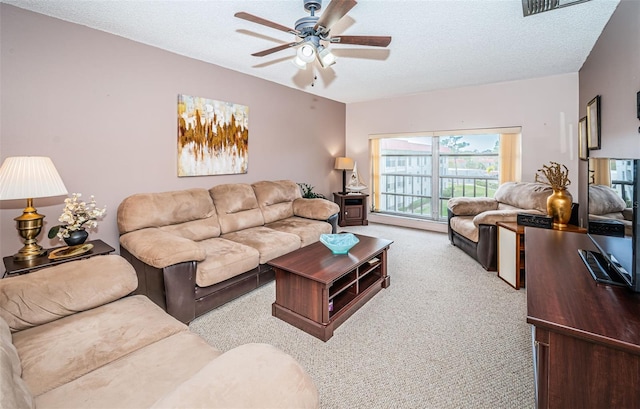2700 Bayshore Blvd Unit 4304, Dunedin, FL 34698 - living area featuring carpet floors, a ceiling fan, and a textured ceiling