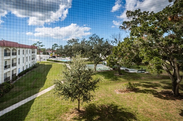 surrounding community featuring a lawn