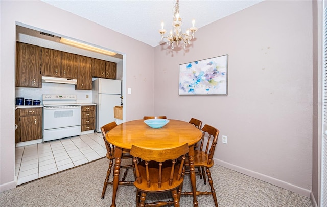 dining area with light tile patterned floors and a notable chandelier