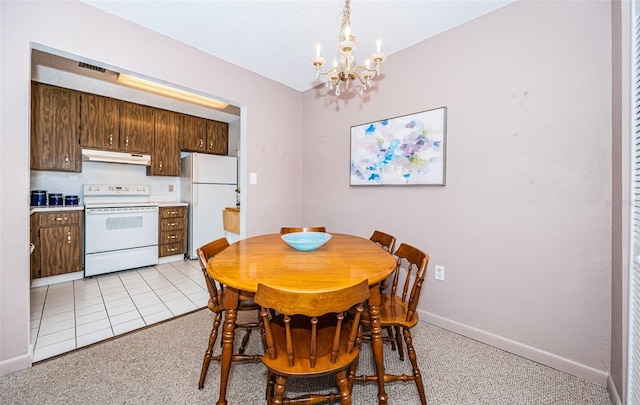 2700 Bayshore Blvd Unit 4304, Dunedin, FL 34698 - dining room featuring a chandelier, baseboards, and light colored carpet