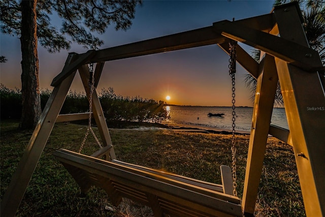 2700 Bayshore Blvd Unit 4304, Dunedin, FL 34698 - yard at dusk with a water view and a lawn