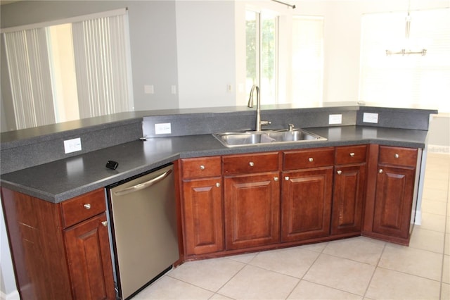 kitchen featuring stainless steel dishwasher, light tile patterned floors, and sink