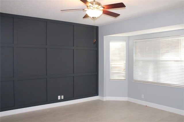 spare room with ceiling fan