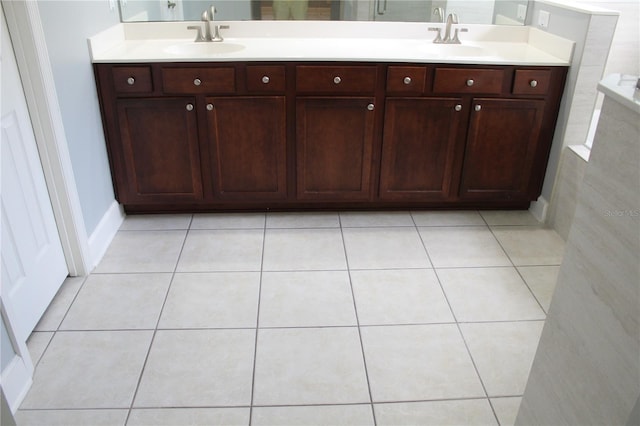 bathroom featuring tile patterned flooring and vanity