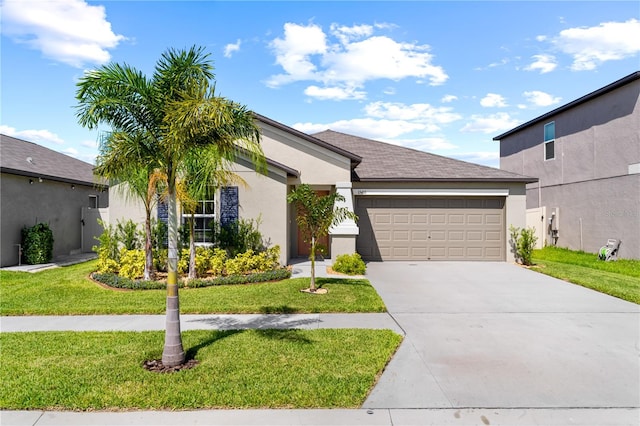 view of front of house with a front yard and a garage