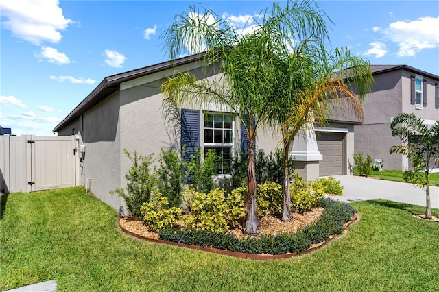 view of home's exterior featuring a garage and a yard