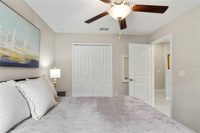 unfurnished bedroom featuring ceiling fan, a closet, and carpet