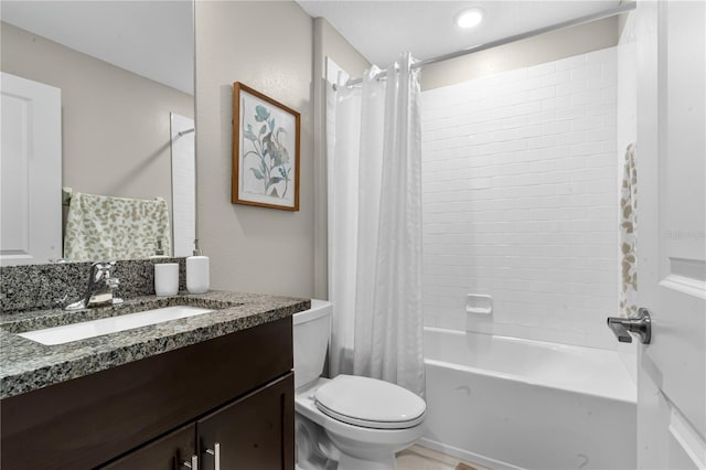 full bathroom featuring shower / tub combo, vanity, and toilet