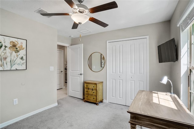 office with ceiling fan and light colored carpet