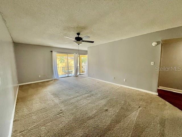 spare room with ceiling fan, carpet, and a textured ceiling