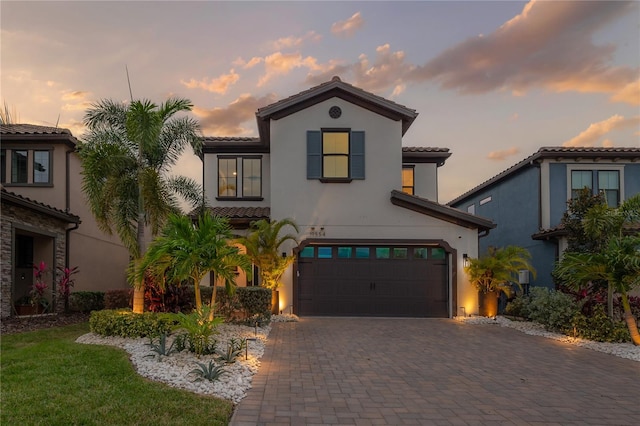 mediterranean / spanish house featuring a garage