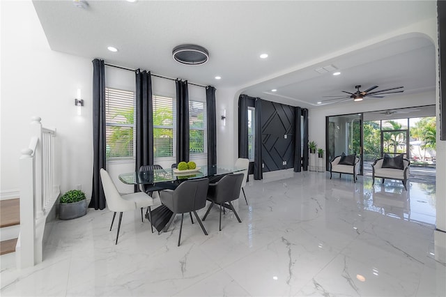 dining space featuring ceiling fan